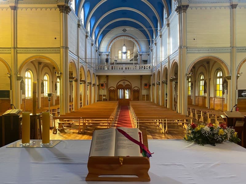 Nave of Sacred Heart Church with blue vaulted ceiling